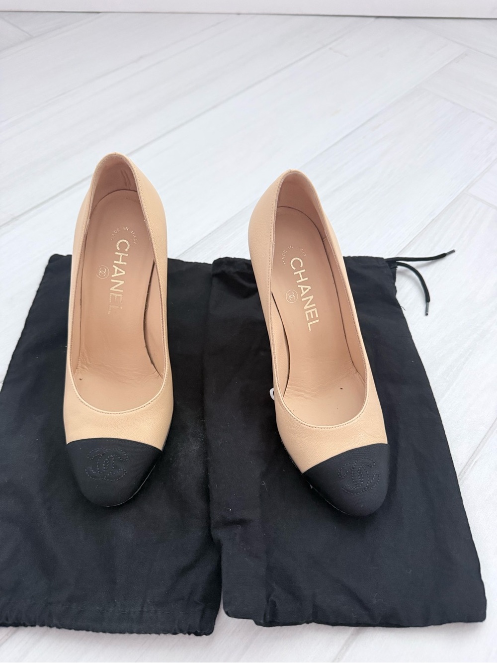 CHANEL Beige Leather Pumps with Black Cap Toe
